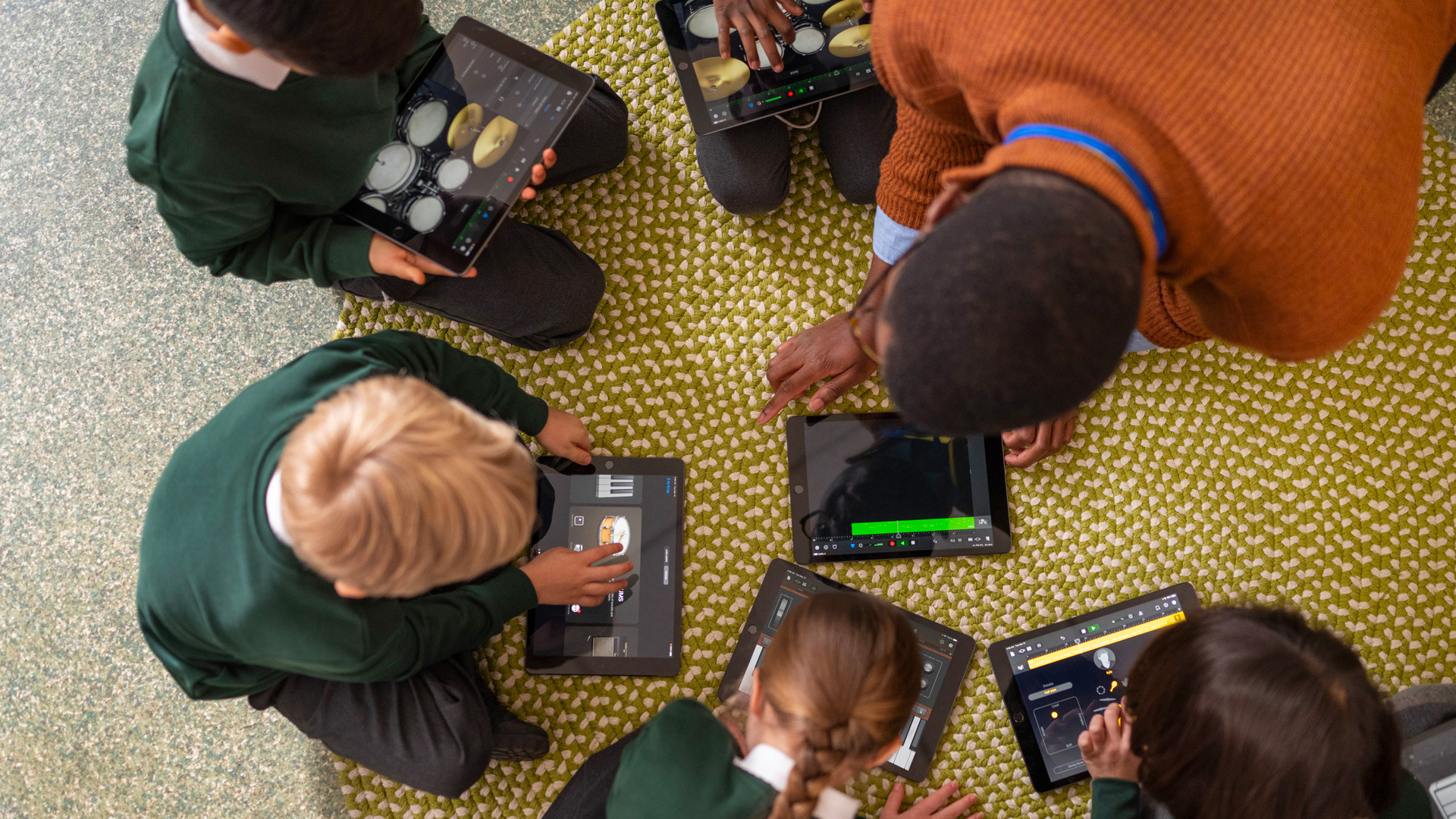 Classroom of children using iPad in an education setting